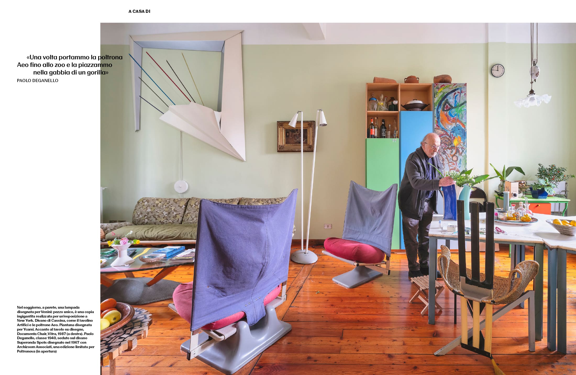 Paolo Deganello’s living room with a large Venini lamp, a Cassina sofa, Aeo armchairs, a Ycami floor lamp and a Documenta Chair by Vitra.